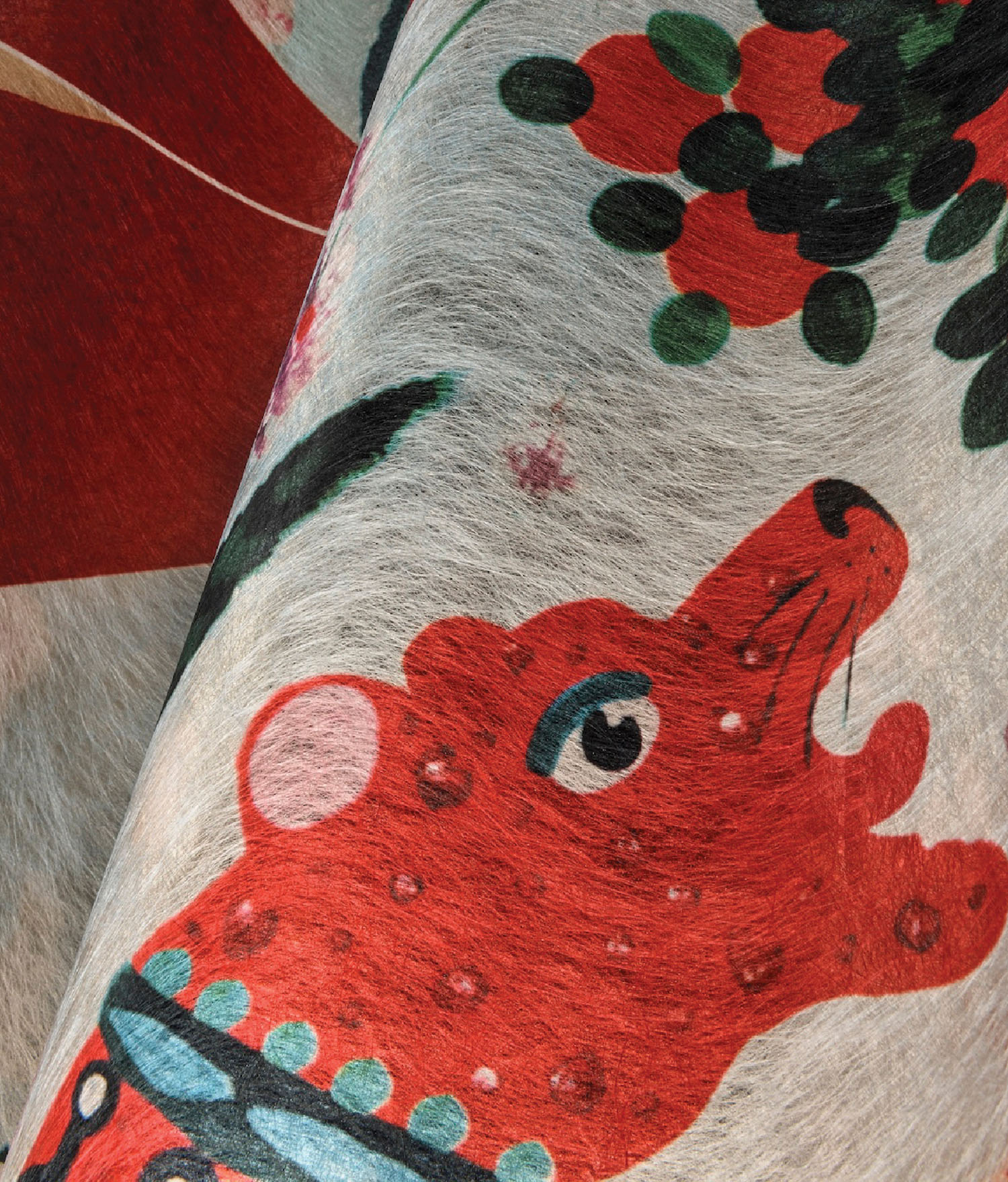 A close up of a red and green elephant.
