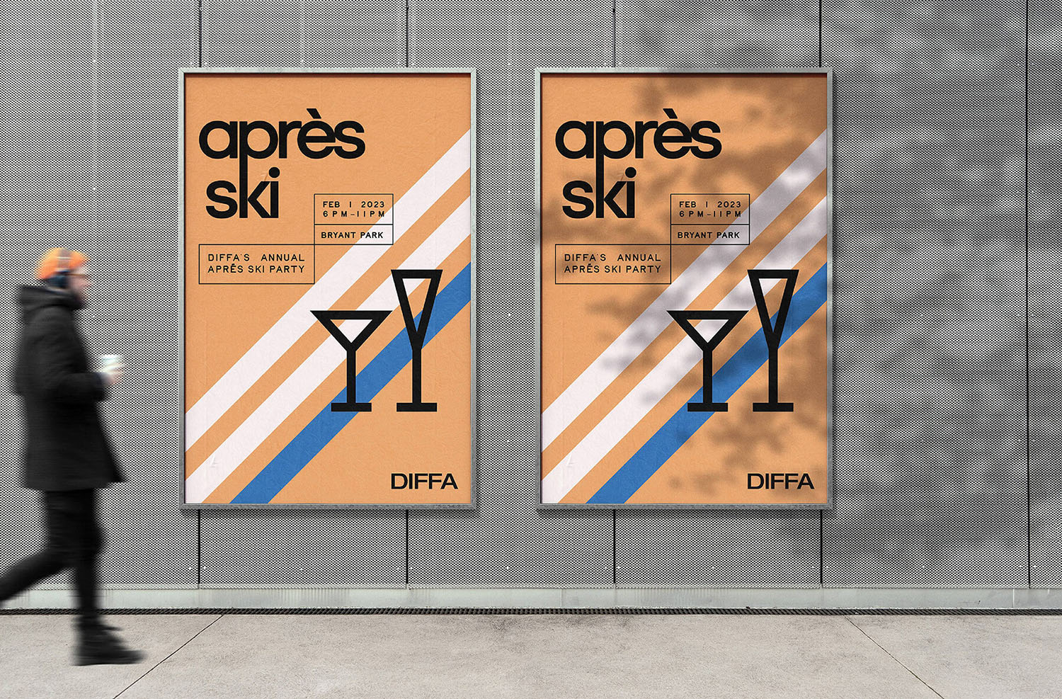 A person walking past a building with posters on it.