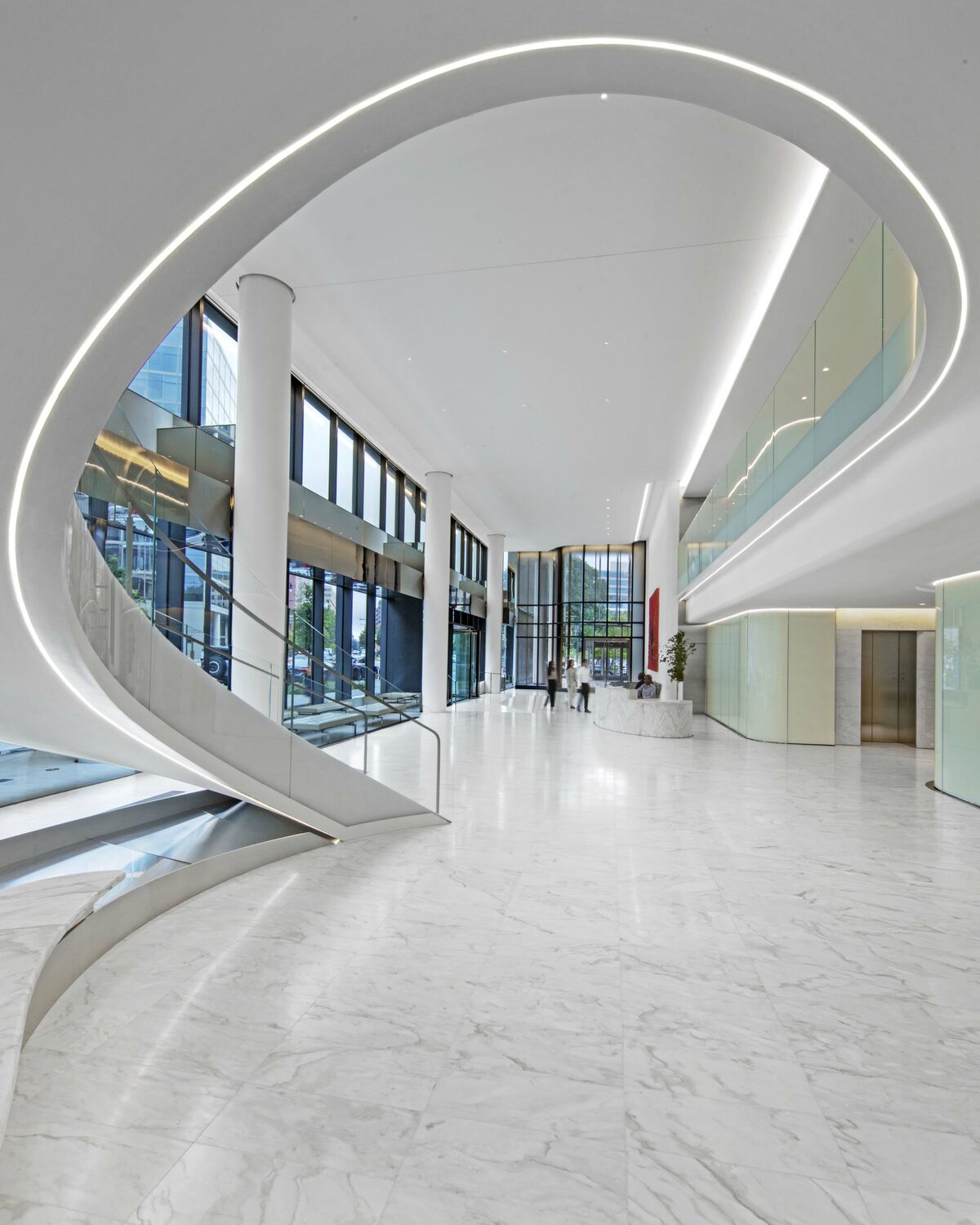 white office with curved staircase