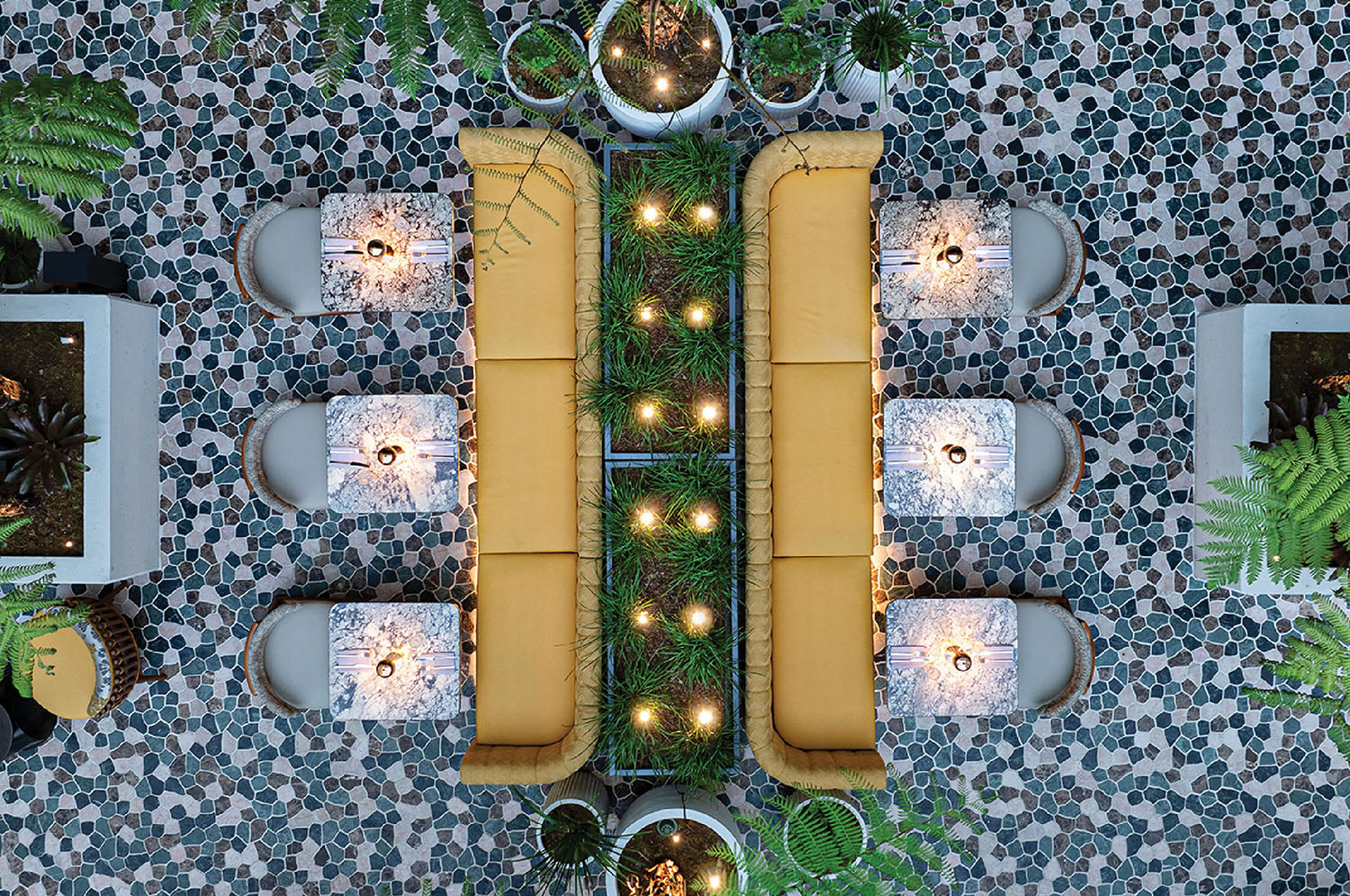 A view of a patio with a table and chairs