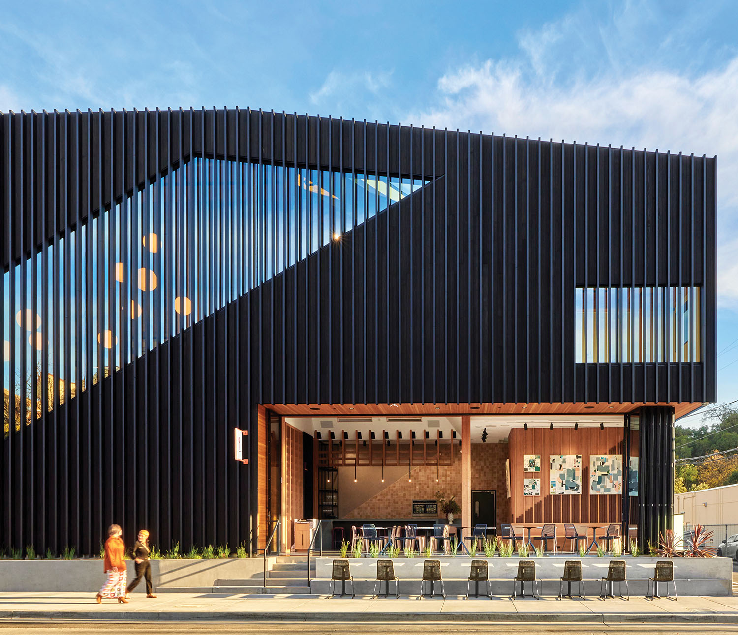 A black building with a large black triangle on the front