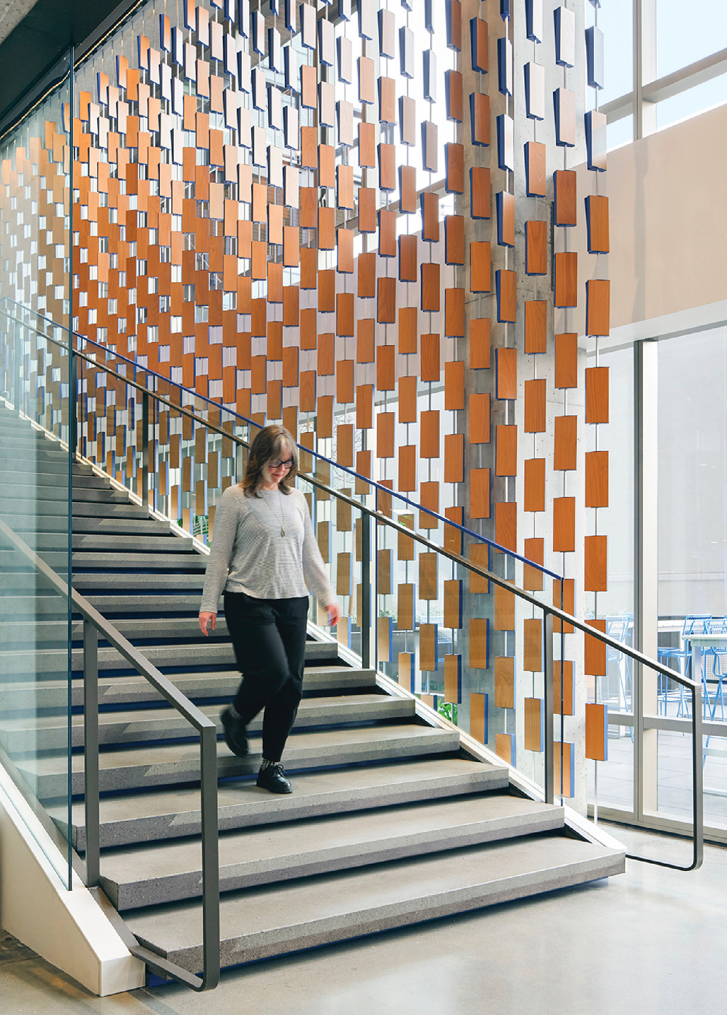 A woman is walking up some stairs