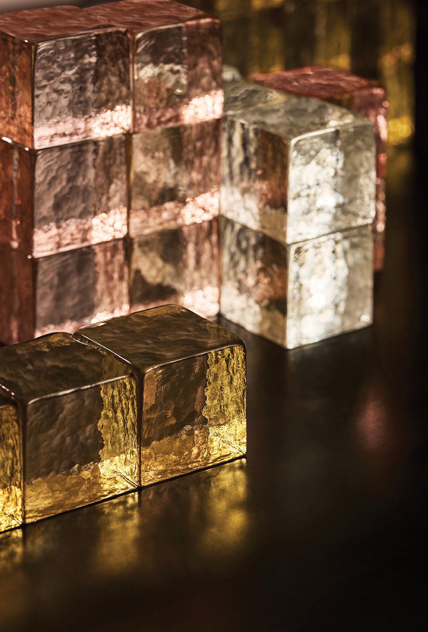 A group of shiny cubes on a table.
