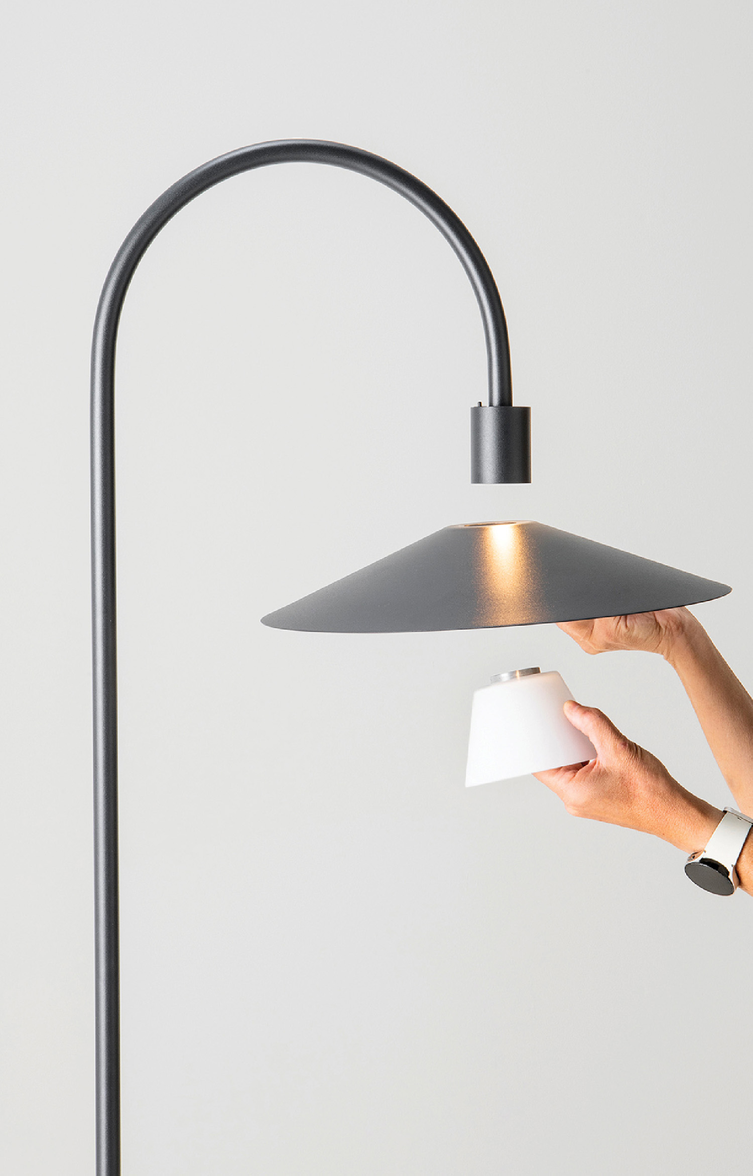 A person holding a paper in their hand.