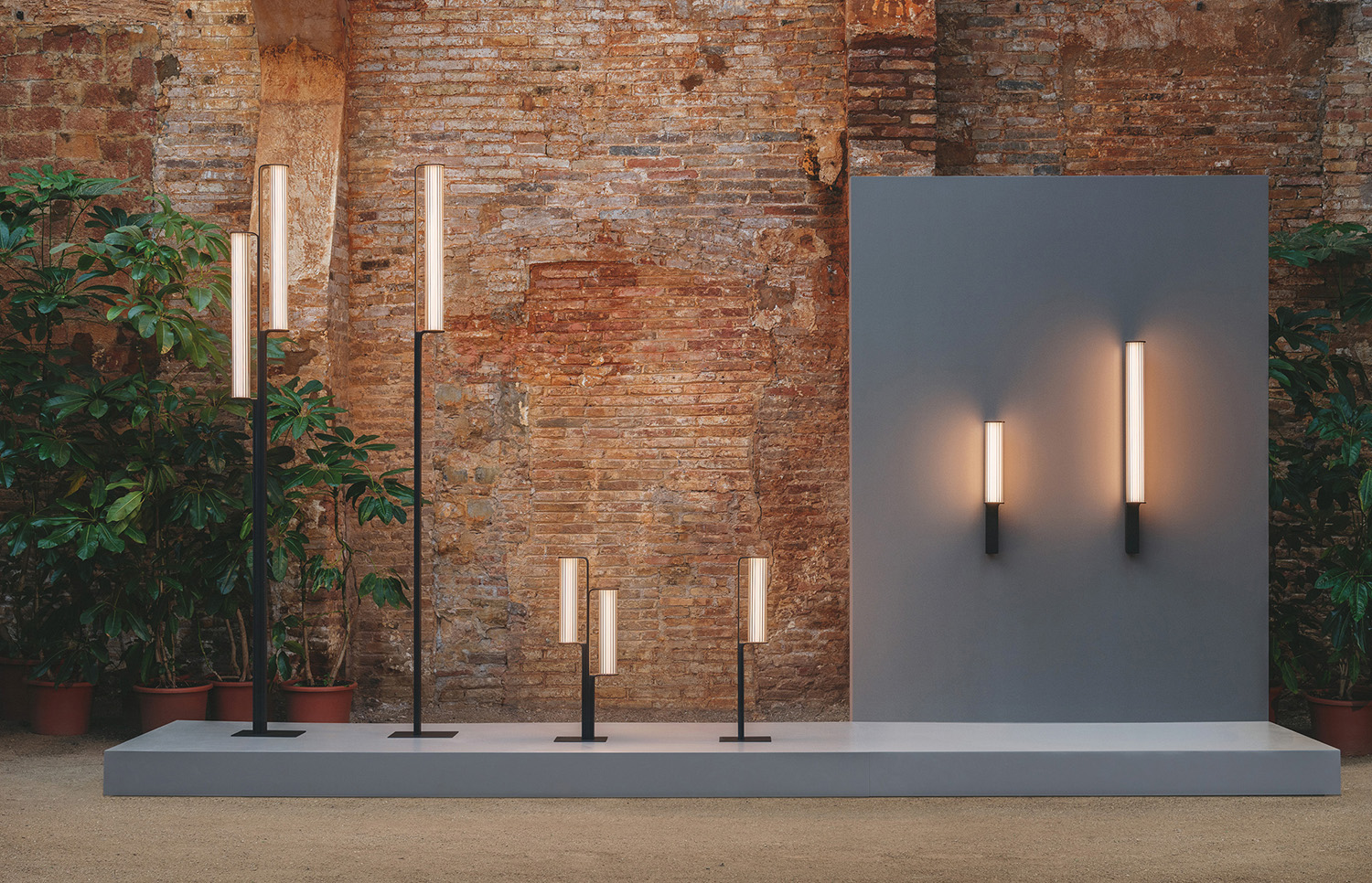 A couple of lights on a table in a room.