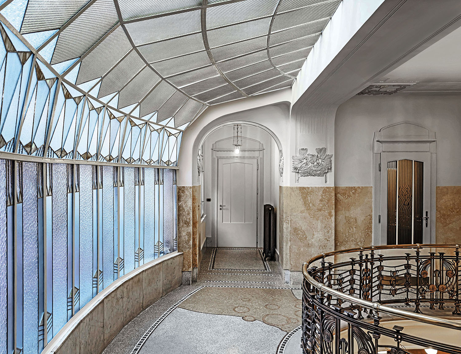 A room with a large window and a tiled floor.