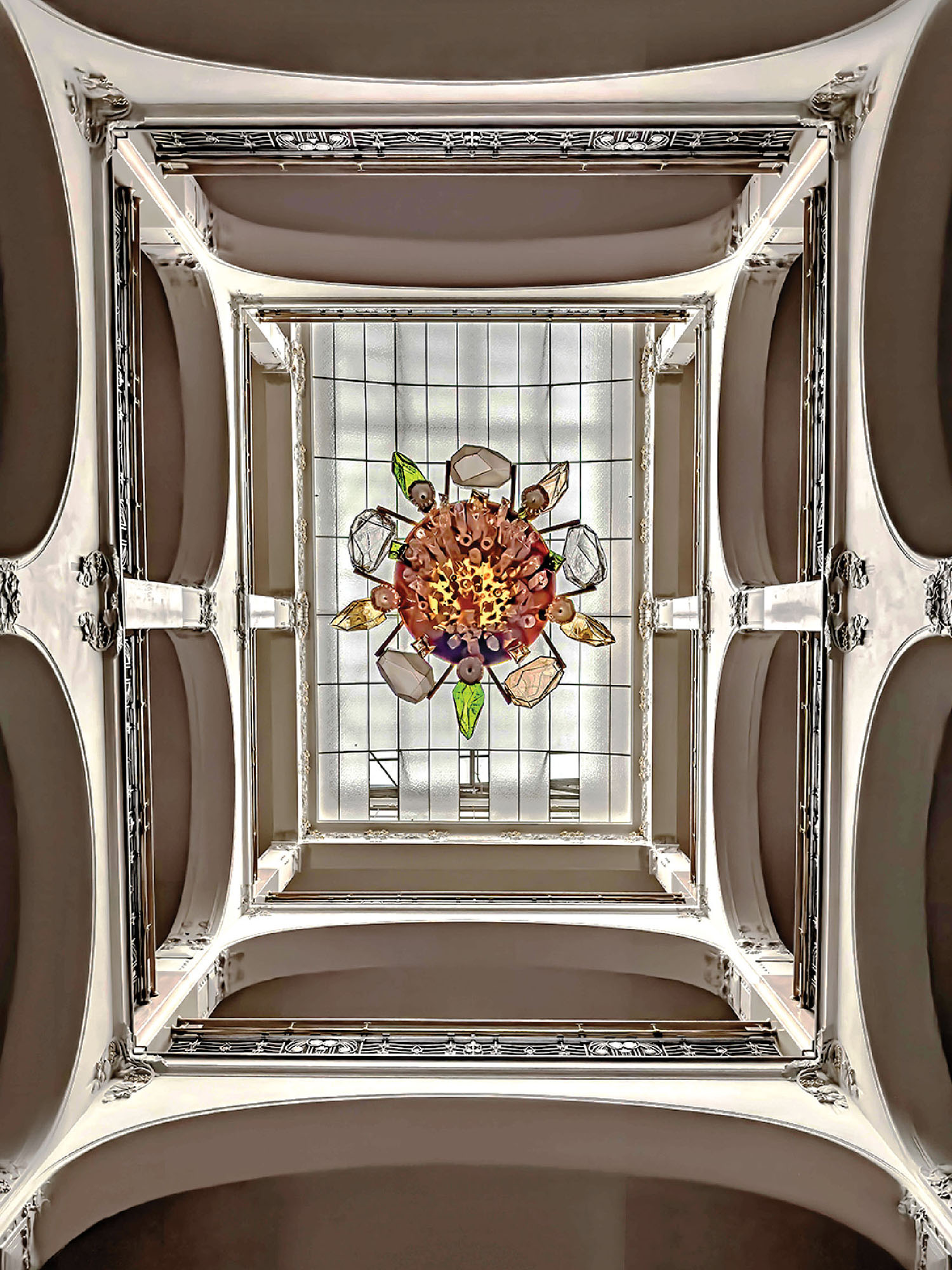 A stained glass window with flowers in it.