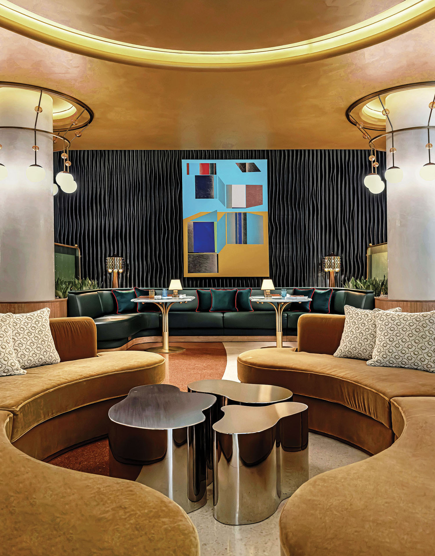 A living room with a couch, a coffee table, and a painting.