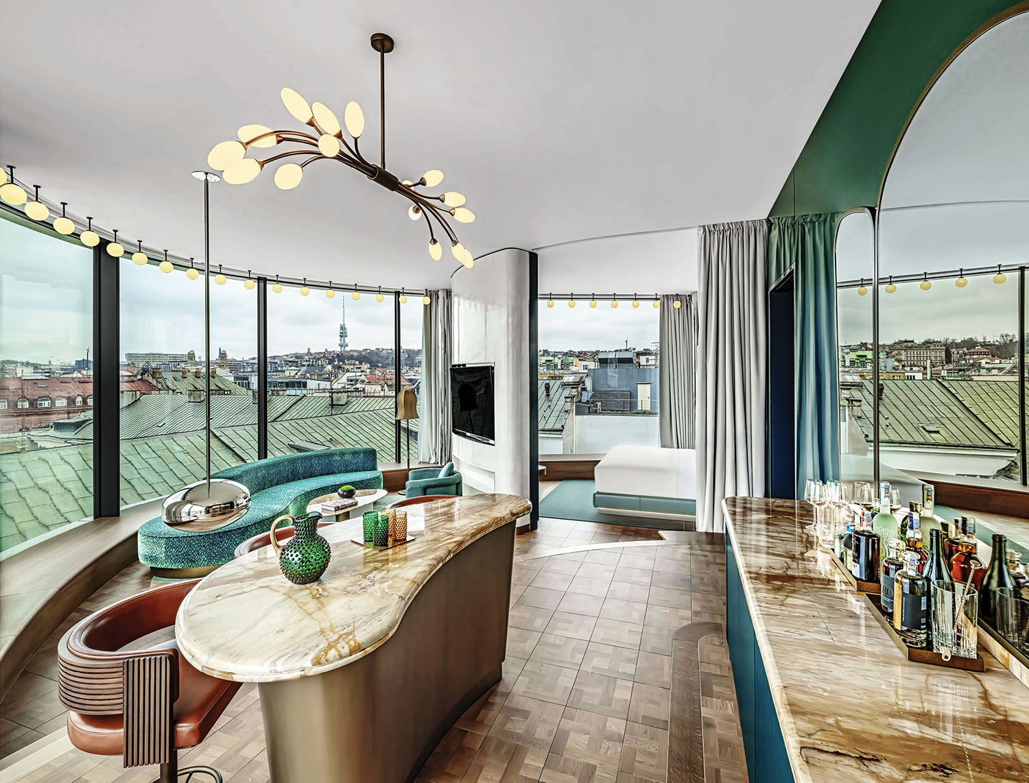 A room with a bar and a view of the city.