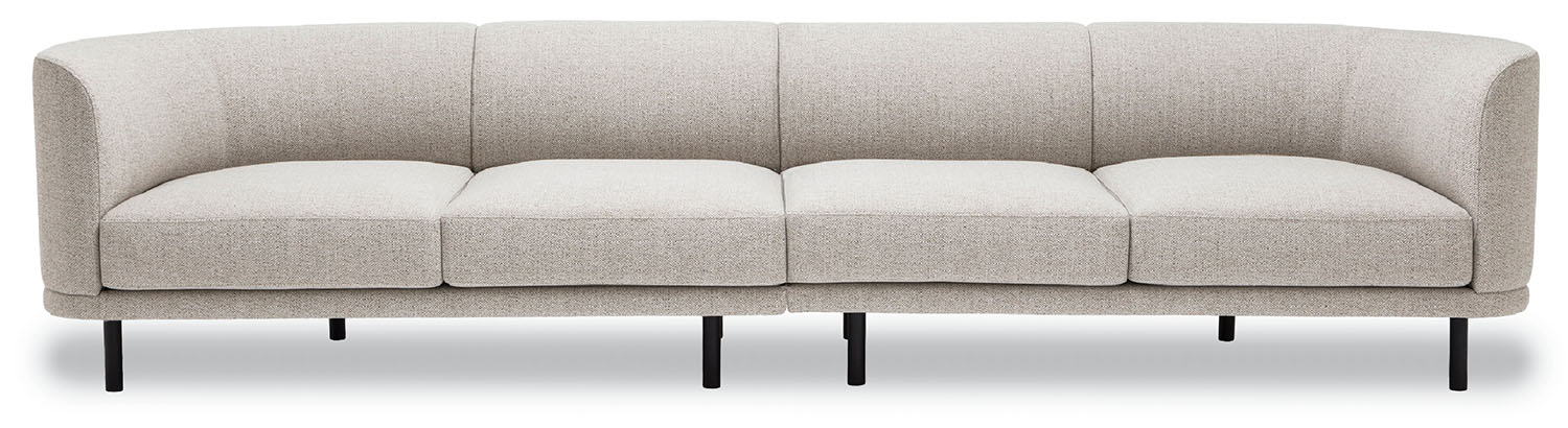 A grey couch with three pillows on it.