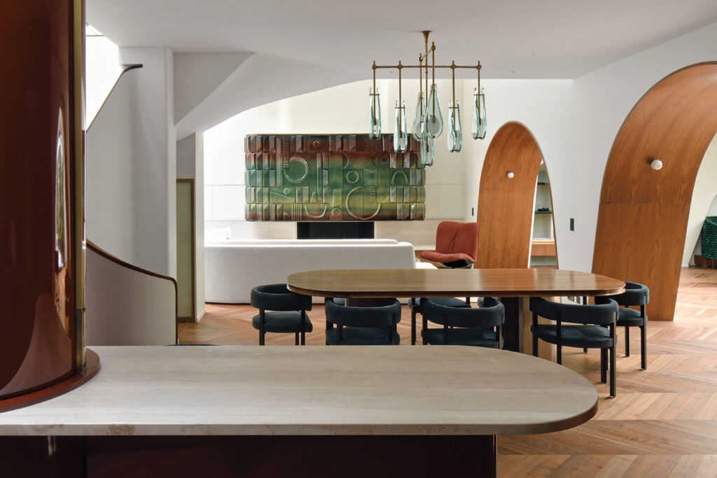 A dining room with a table and chairs