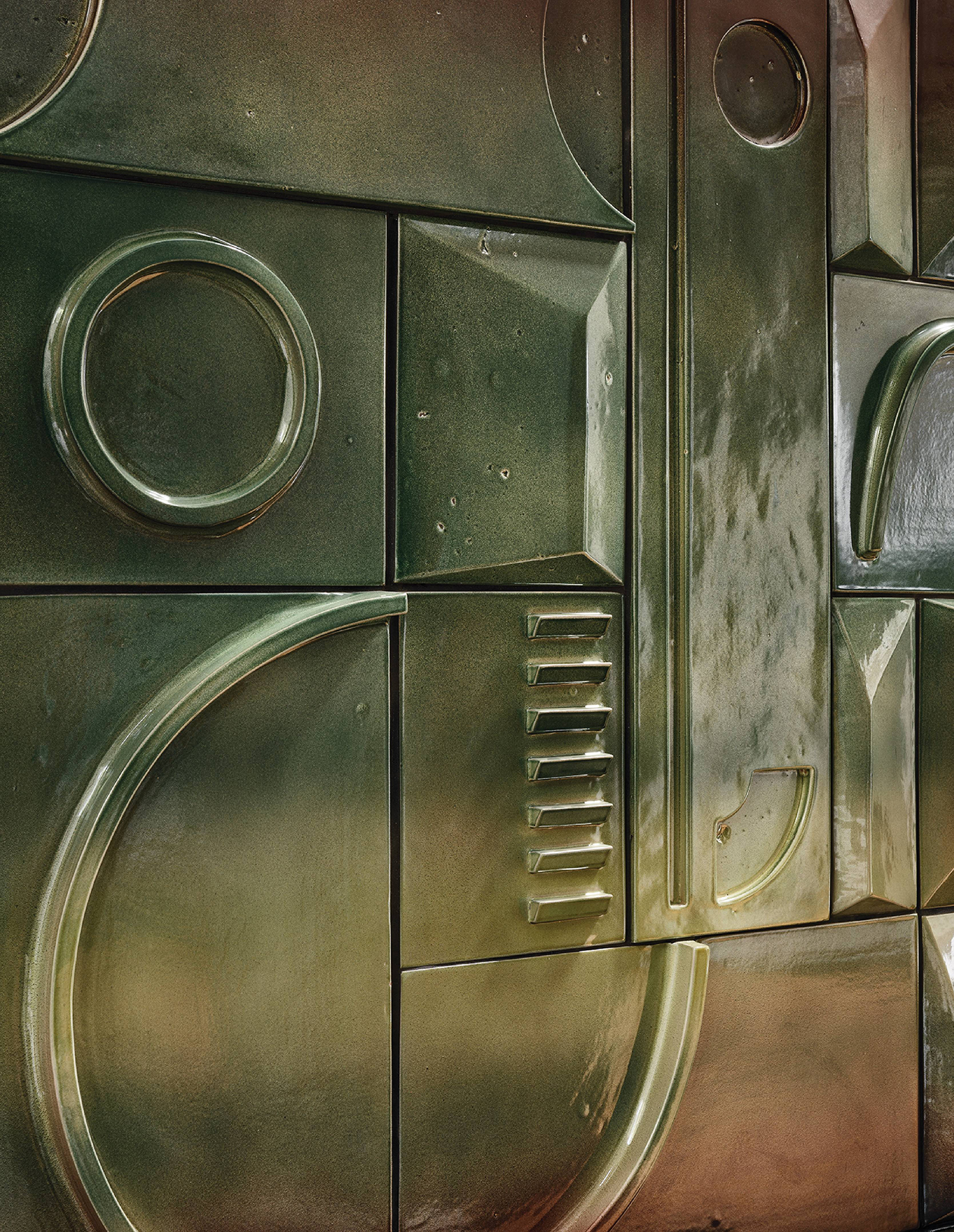 A metal wall with a clock on it