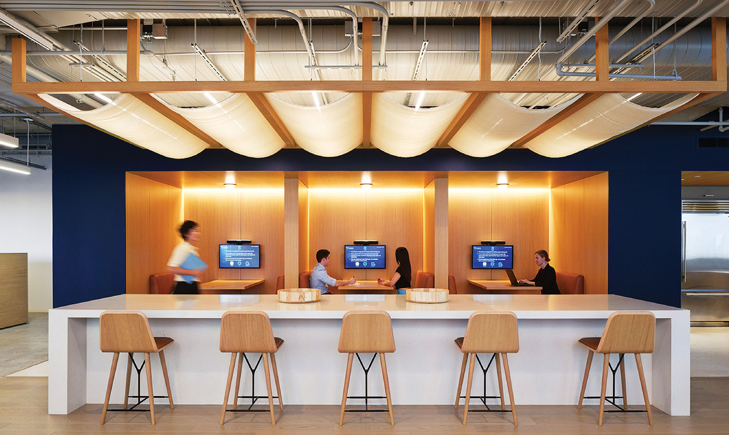 A couple of people sitting at a table in a room