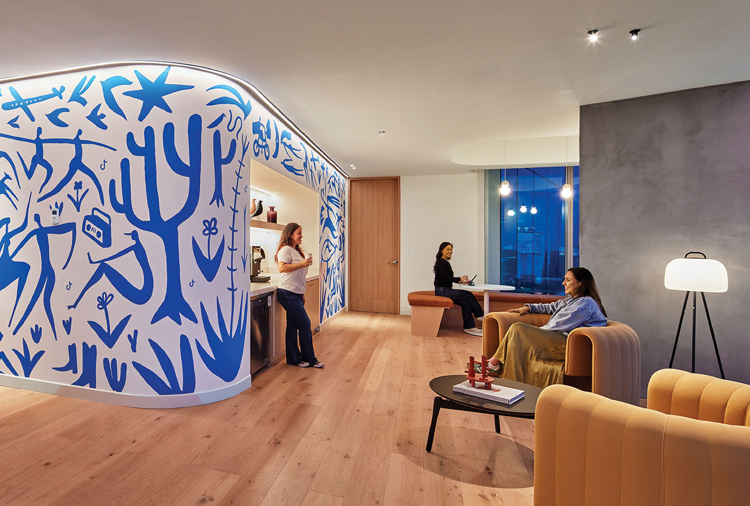 A couple of people sitting in a room