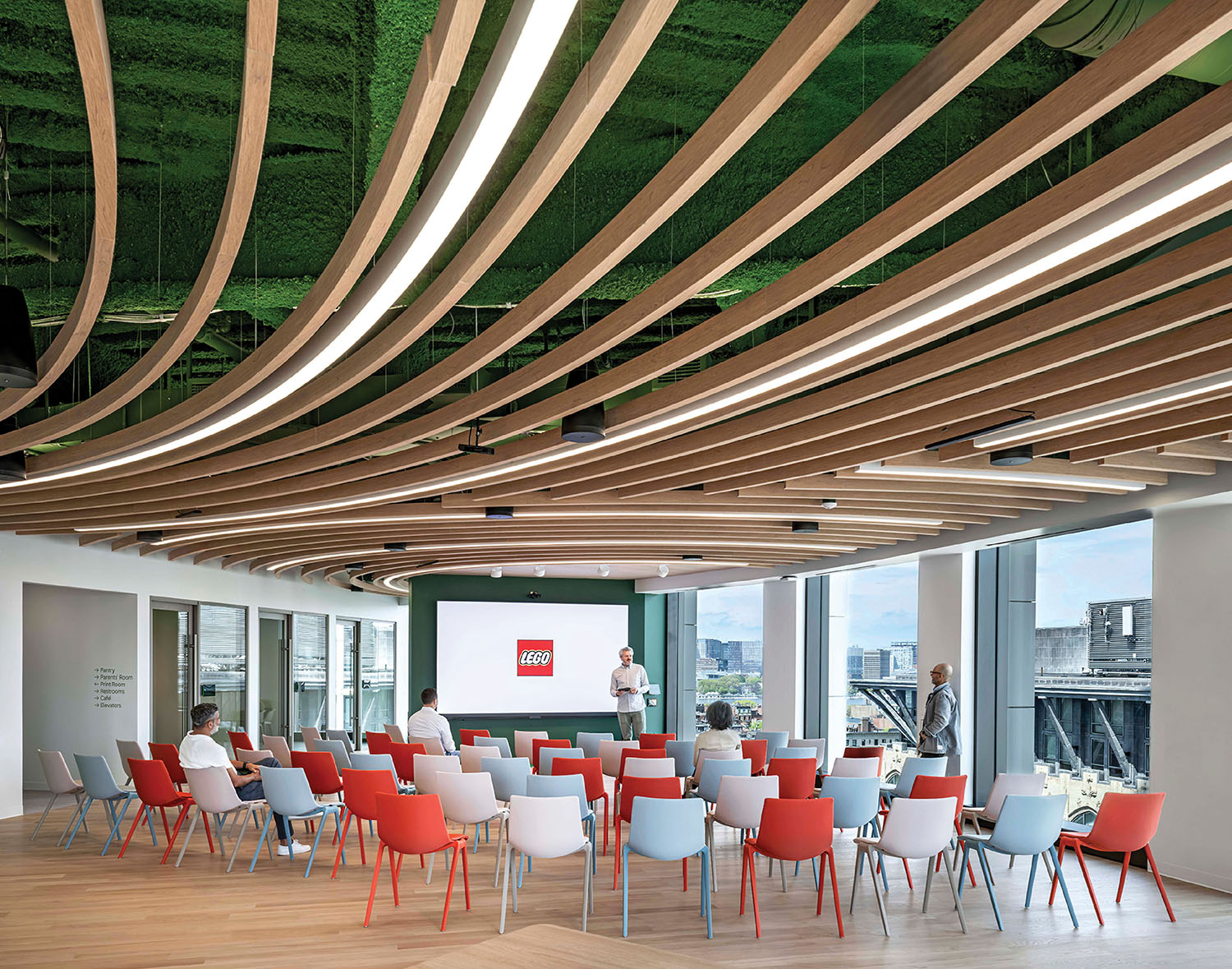 A room with a lot of chairs and tables.