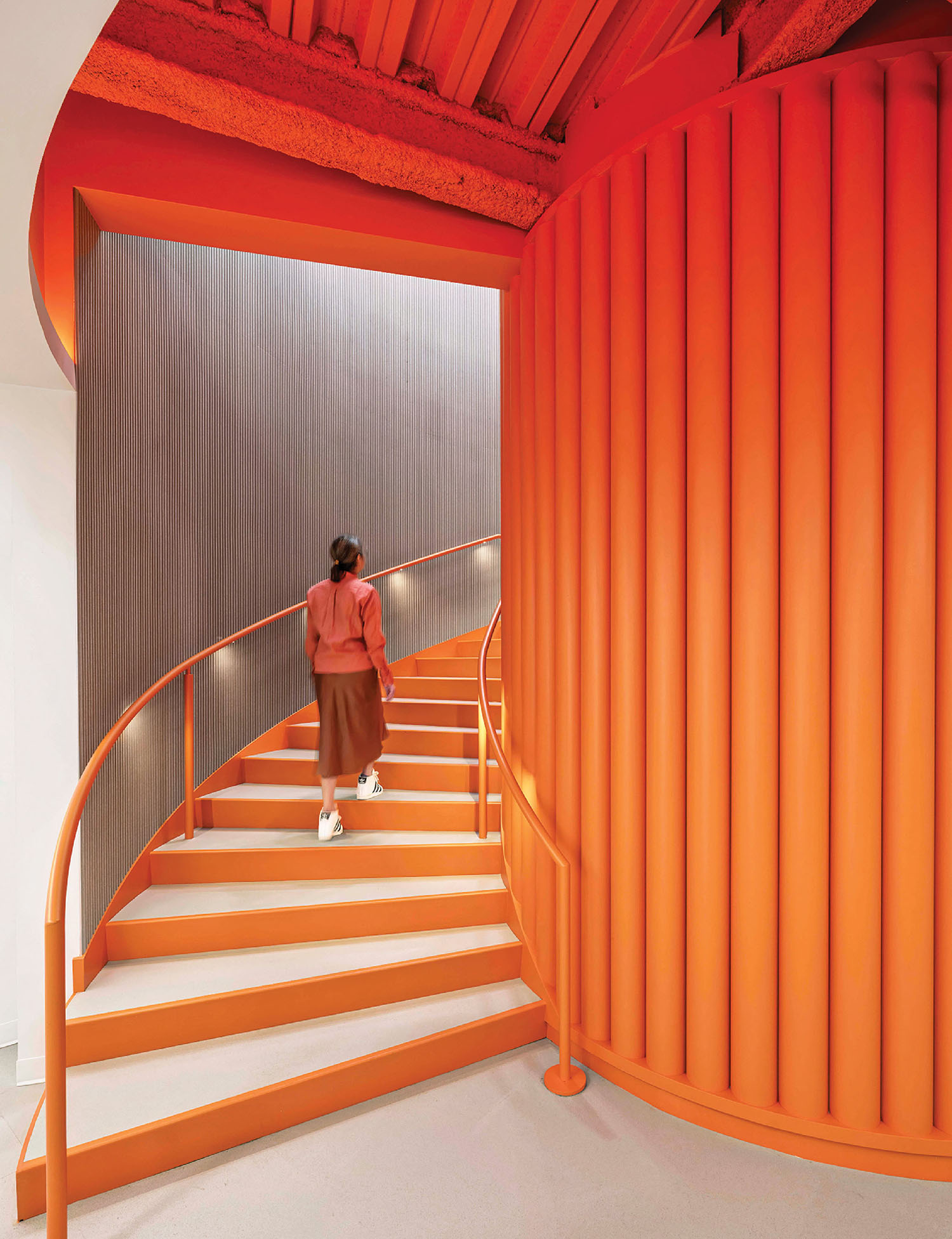 A woman walking down a set of stairs.
