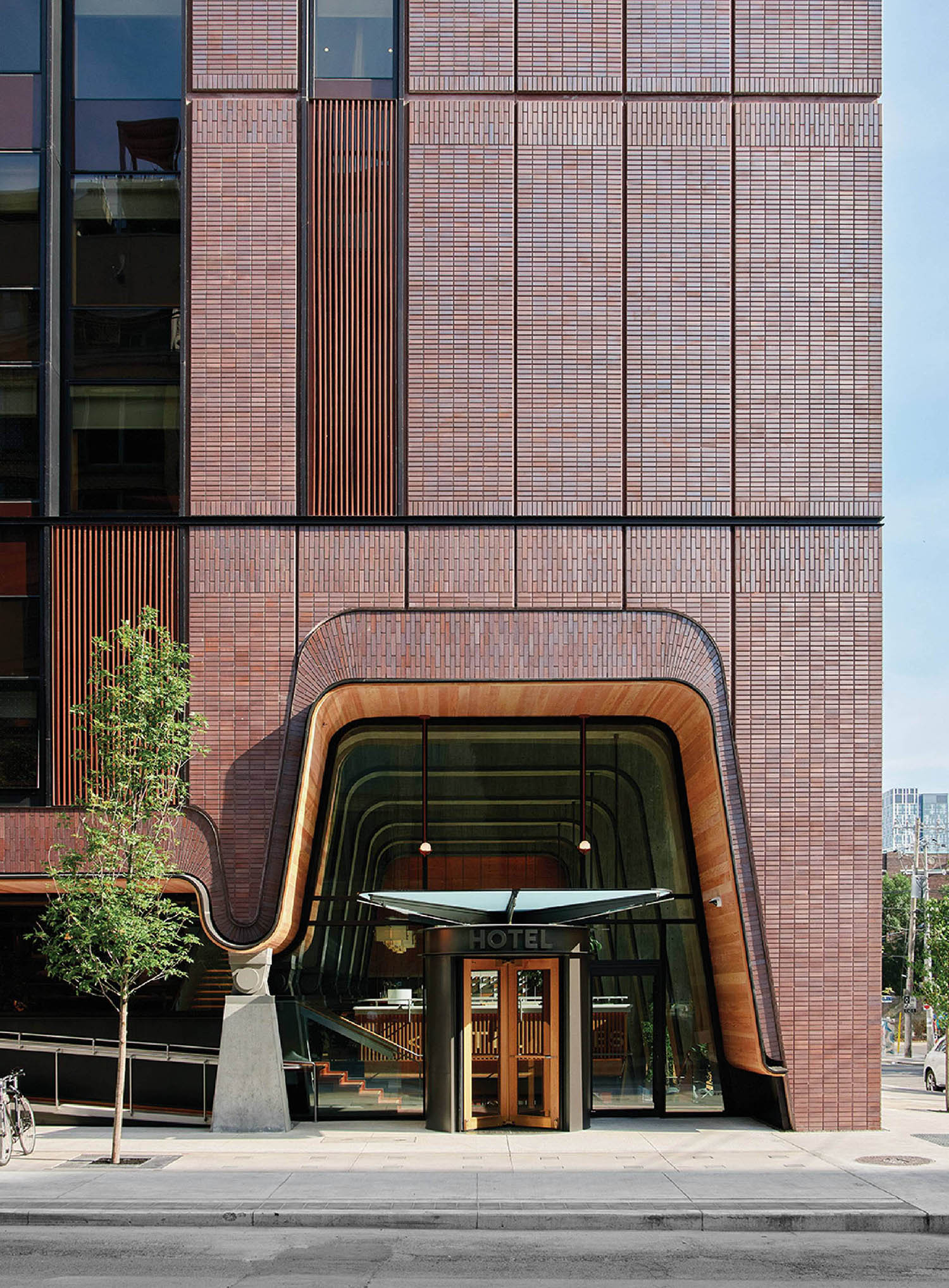The entrance to the building is made of brick.