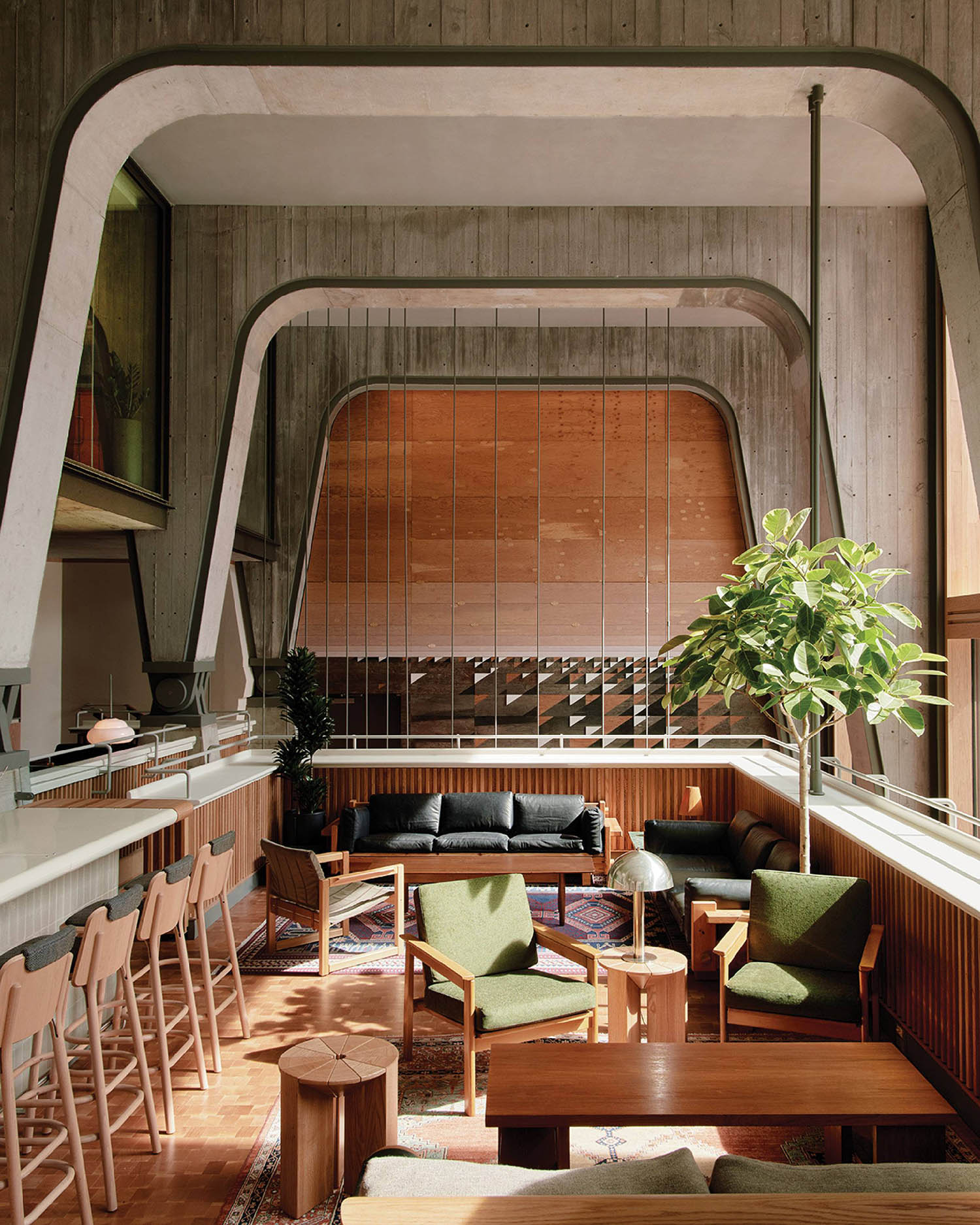 A living room with a couch, table and chairs.