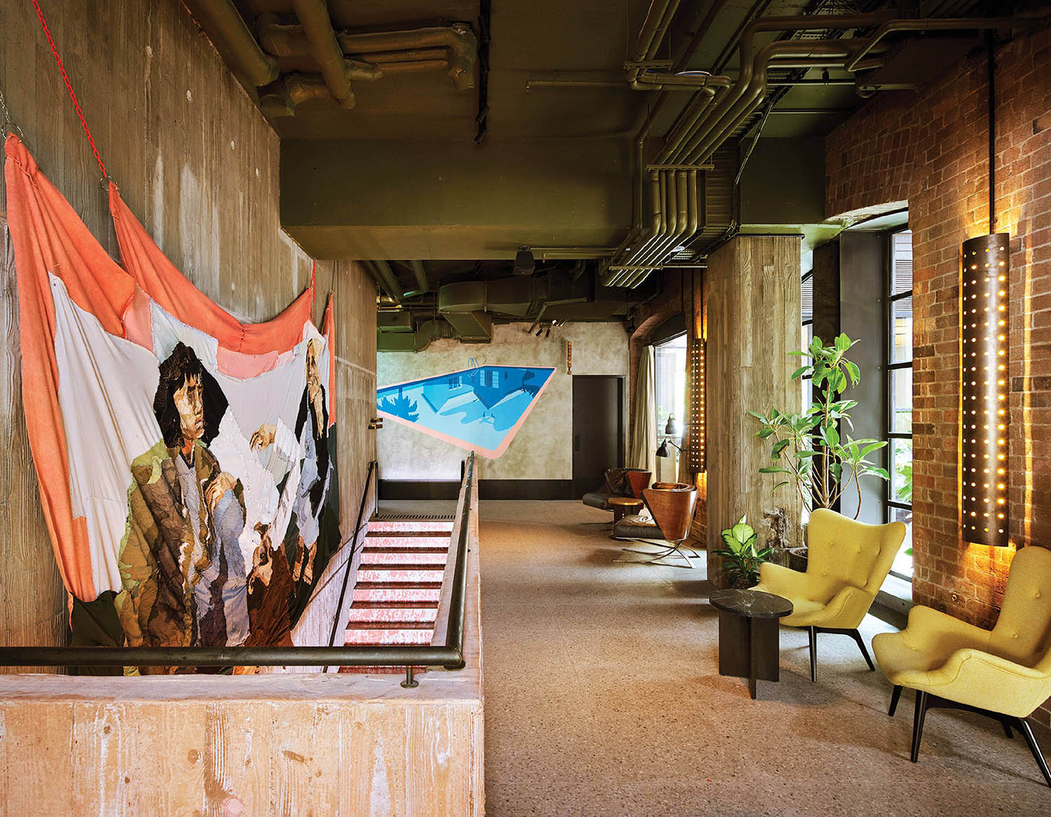 A room with a large painting of a woman.