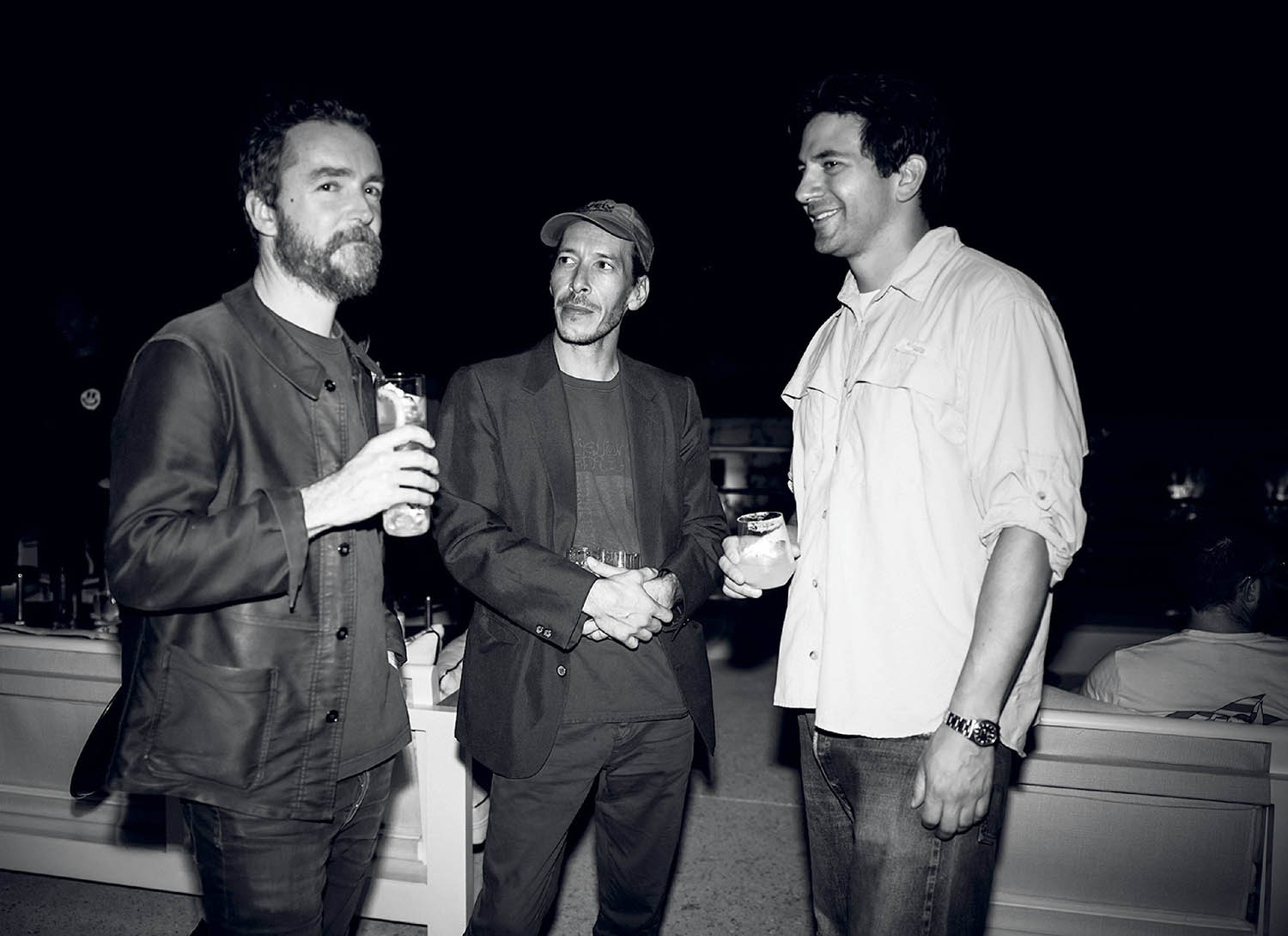 Two men standing next to each other man.