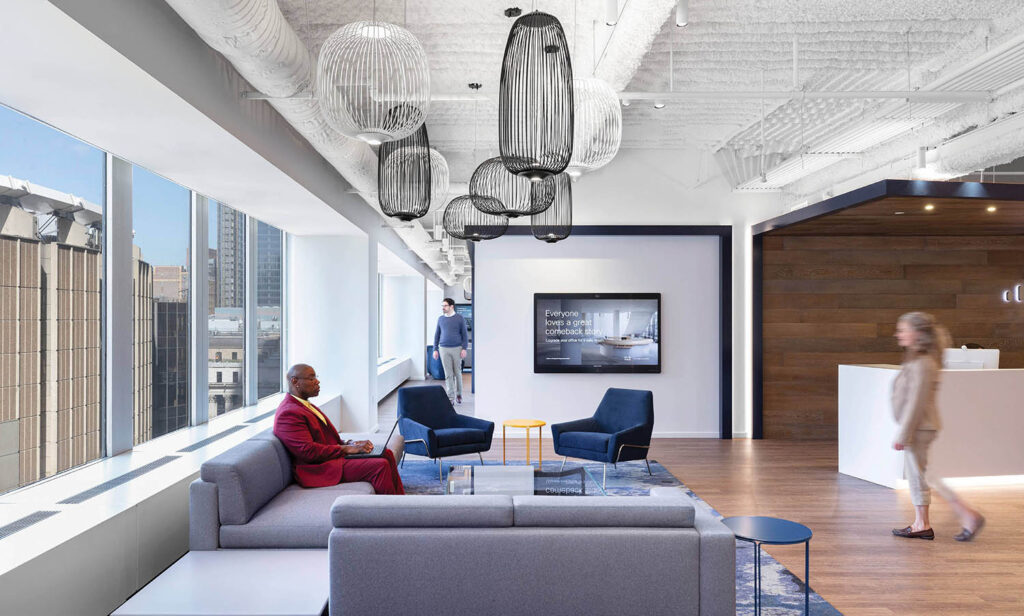 A woman sitting on a couch in a living room.