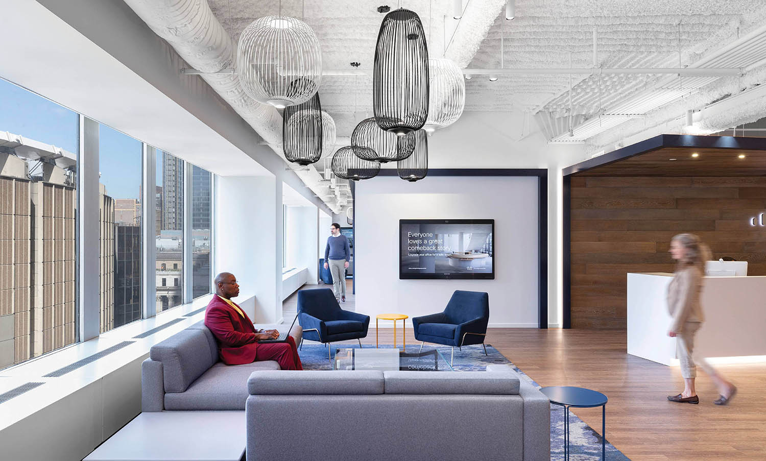 A woman sitting on a couch in a living room.