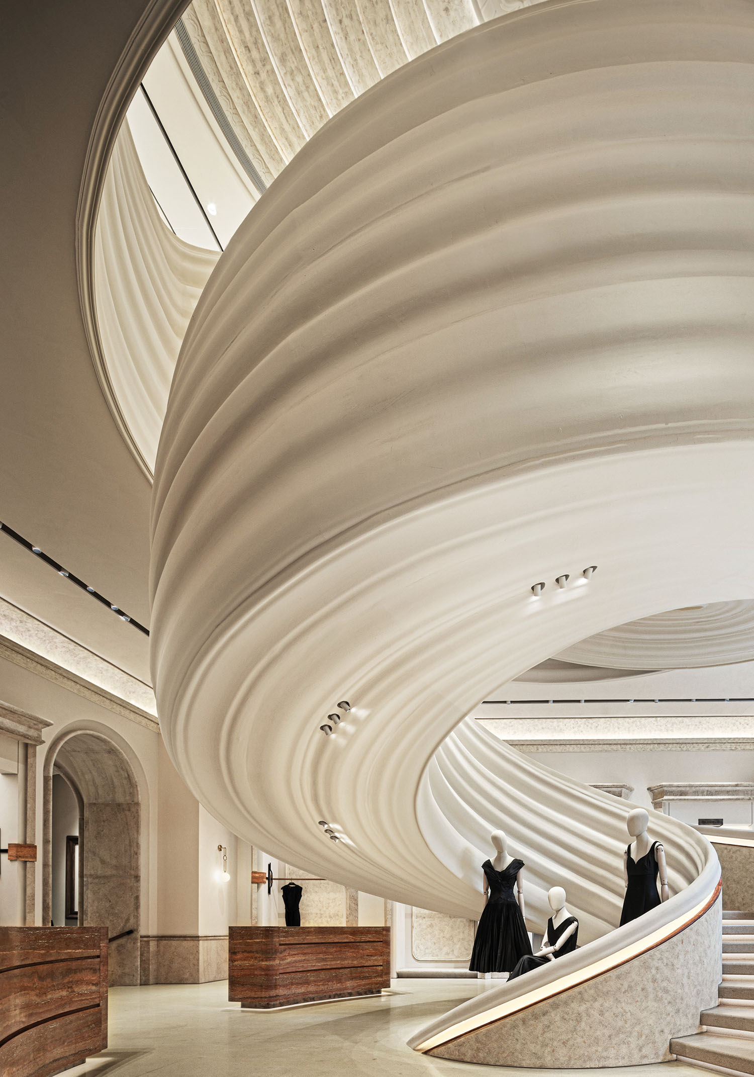 A large white curved staircase.