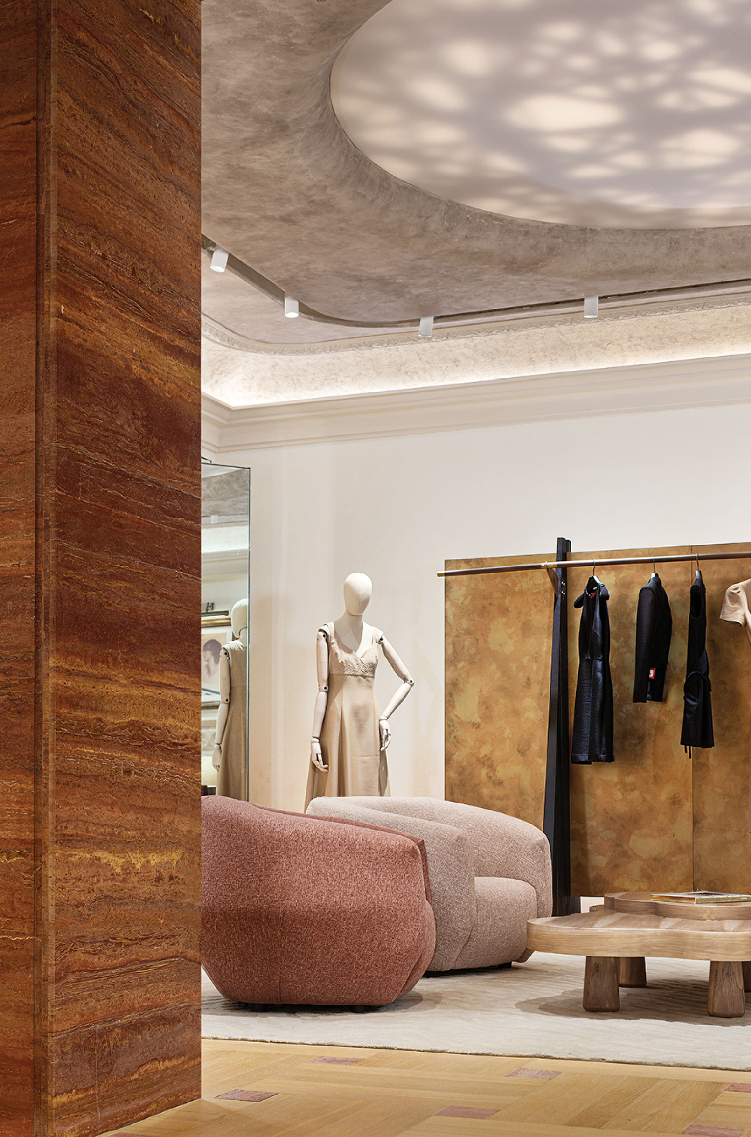 A room with a couch, a chair, and a table.