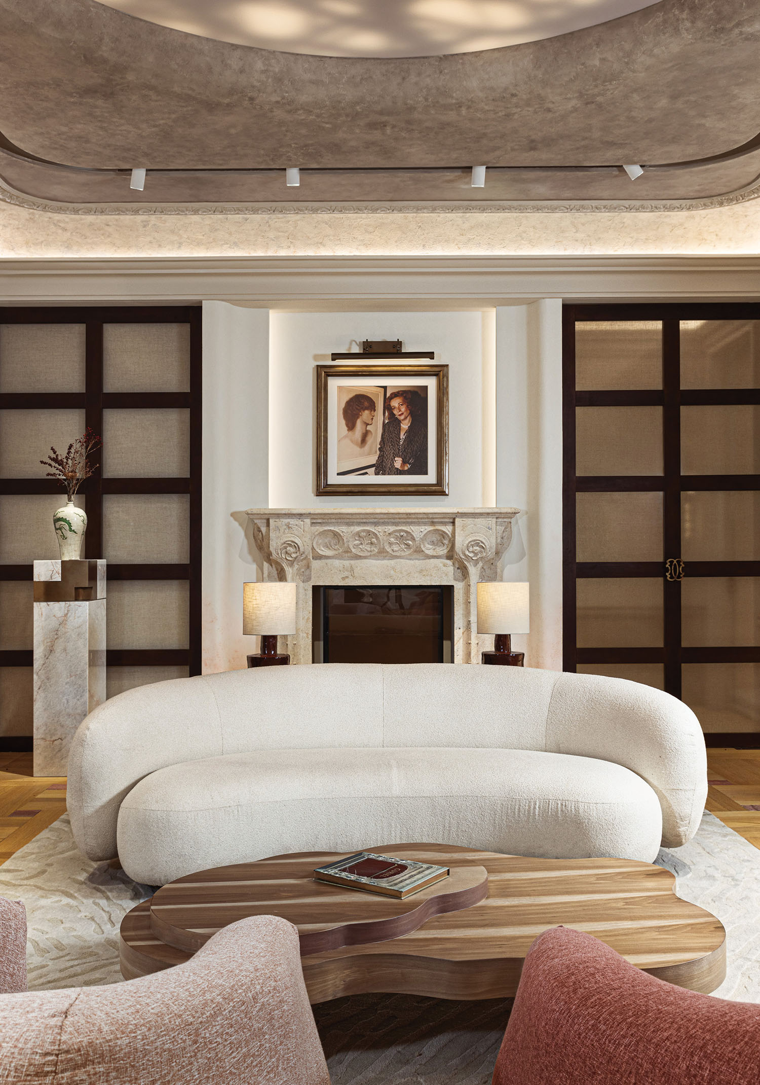 A living room with a large white couch.