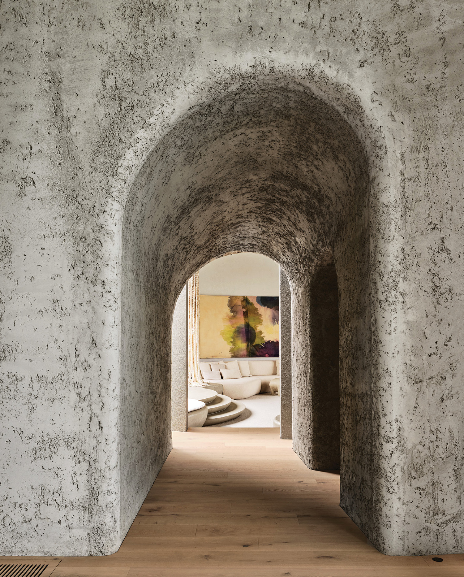 A long hallway with a toilet and a toilet in the middle