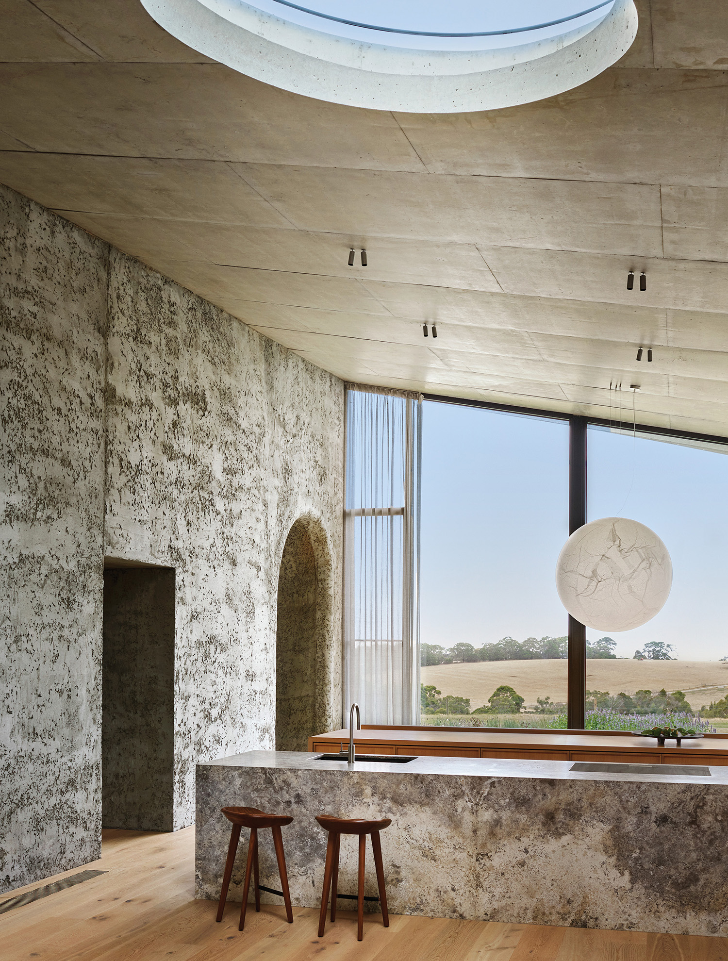 A room with a large window and a clock