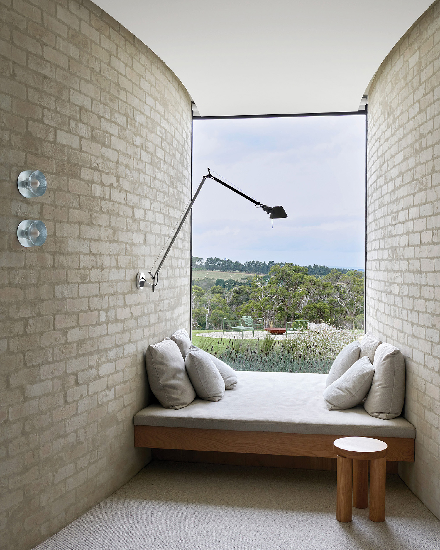 A window seat with a view of a field