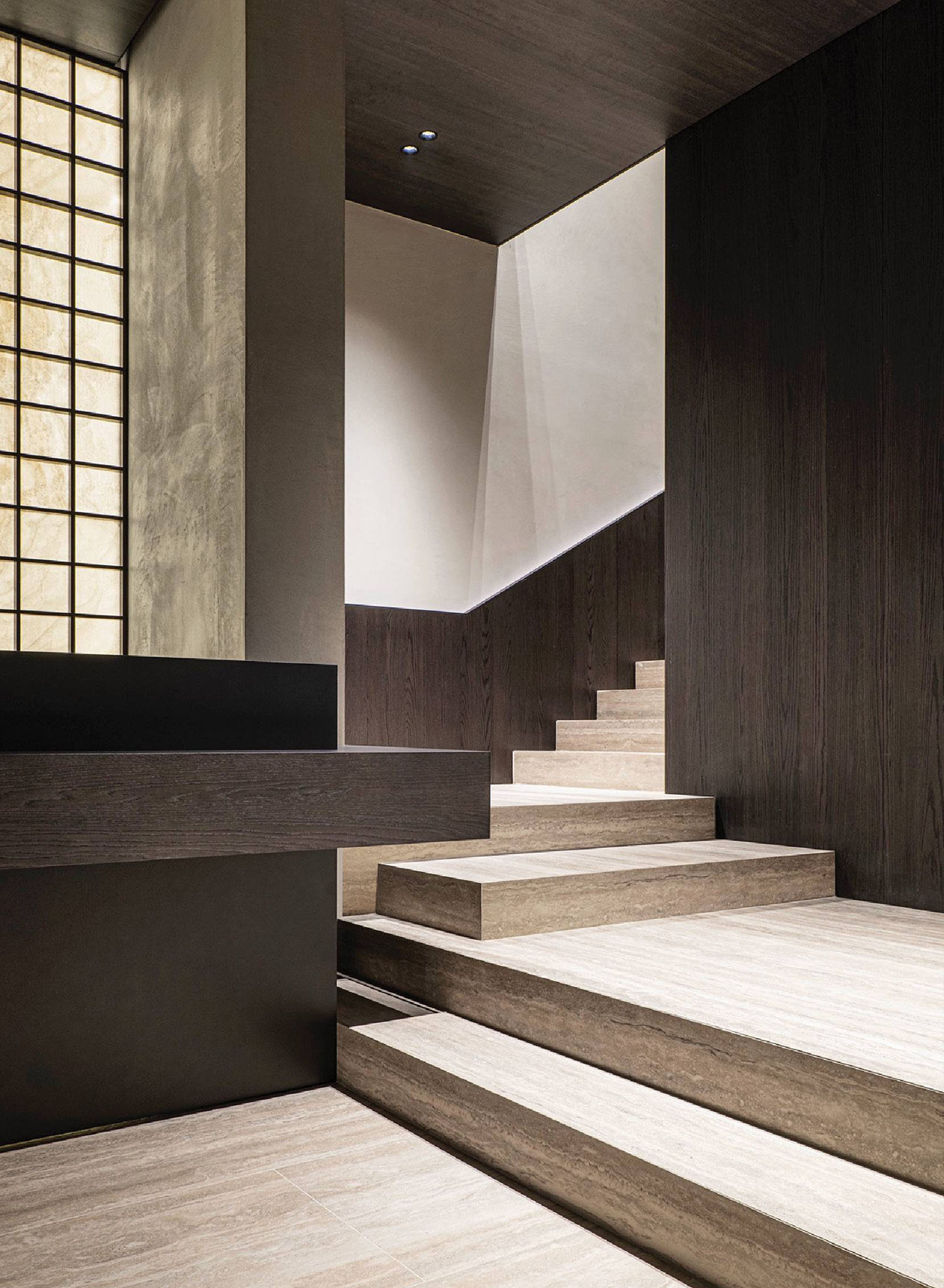 A staircase with wooden steps leading up to a window.