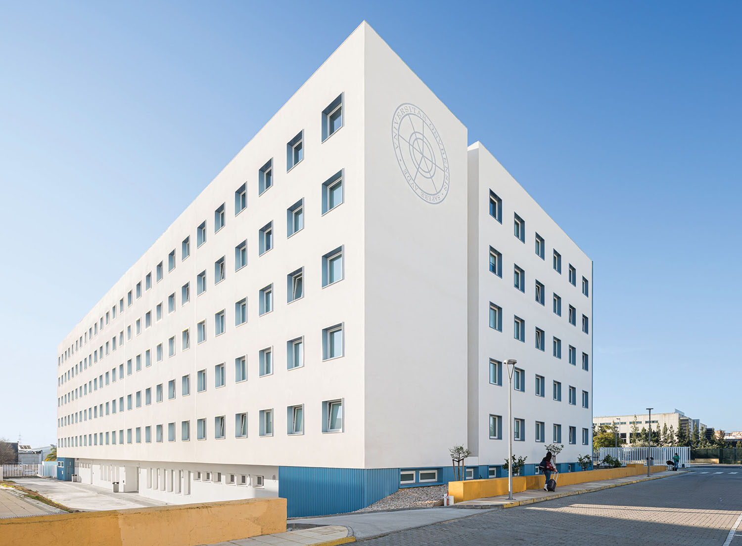 the building is white and has a blue roof
