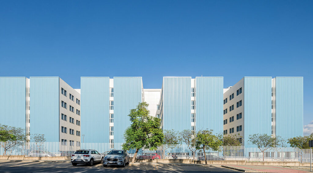 a white car parked in front of a building