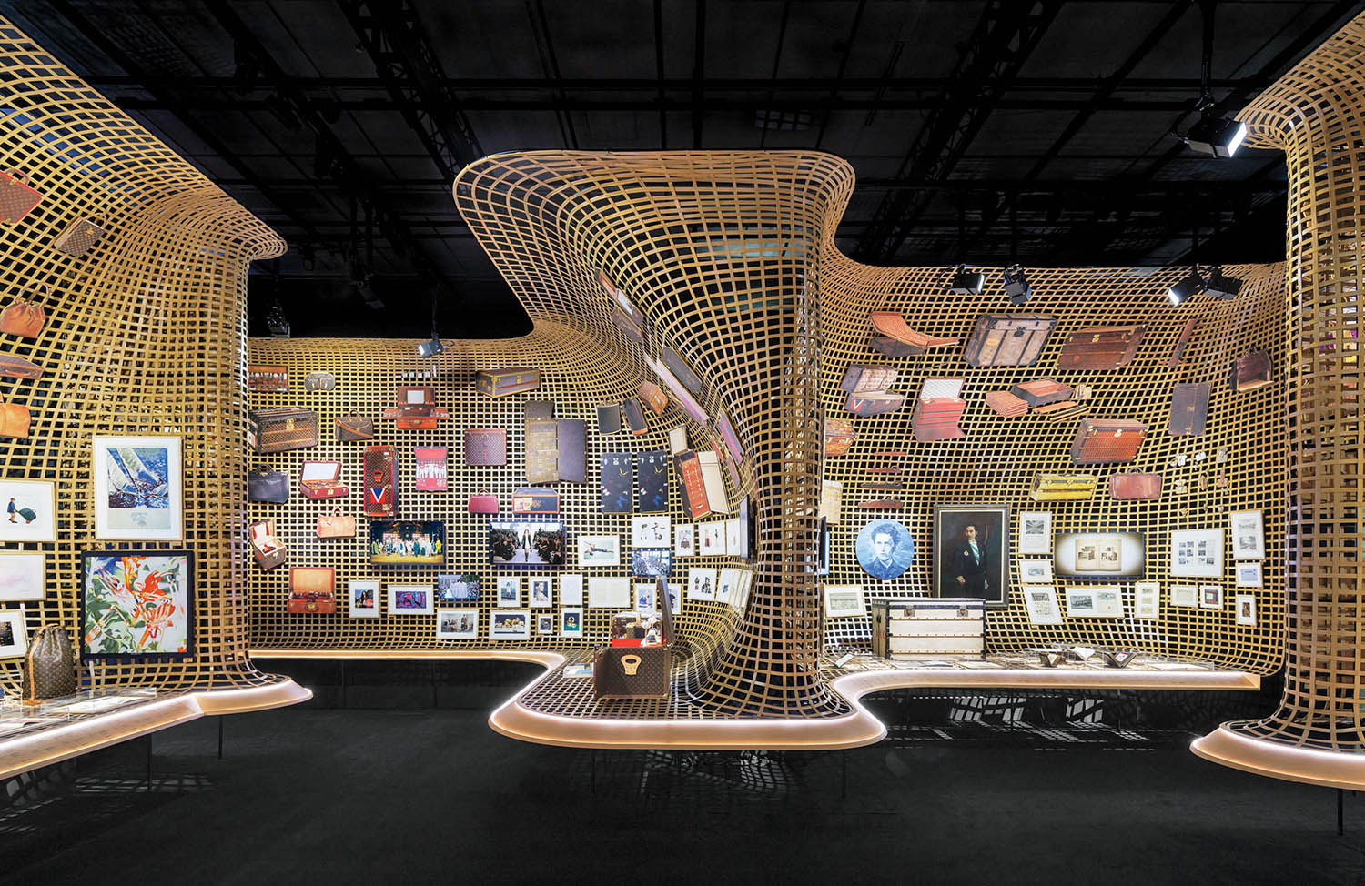 A room with a large number of wooden sculptures.