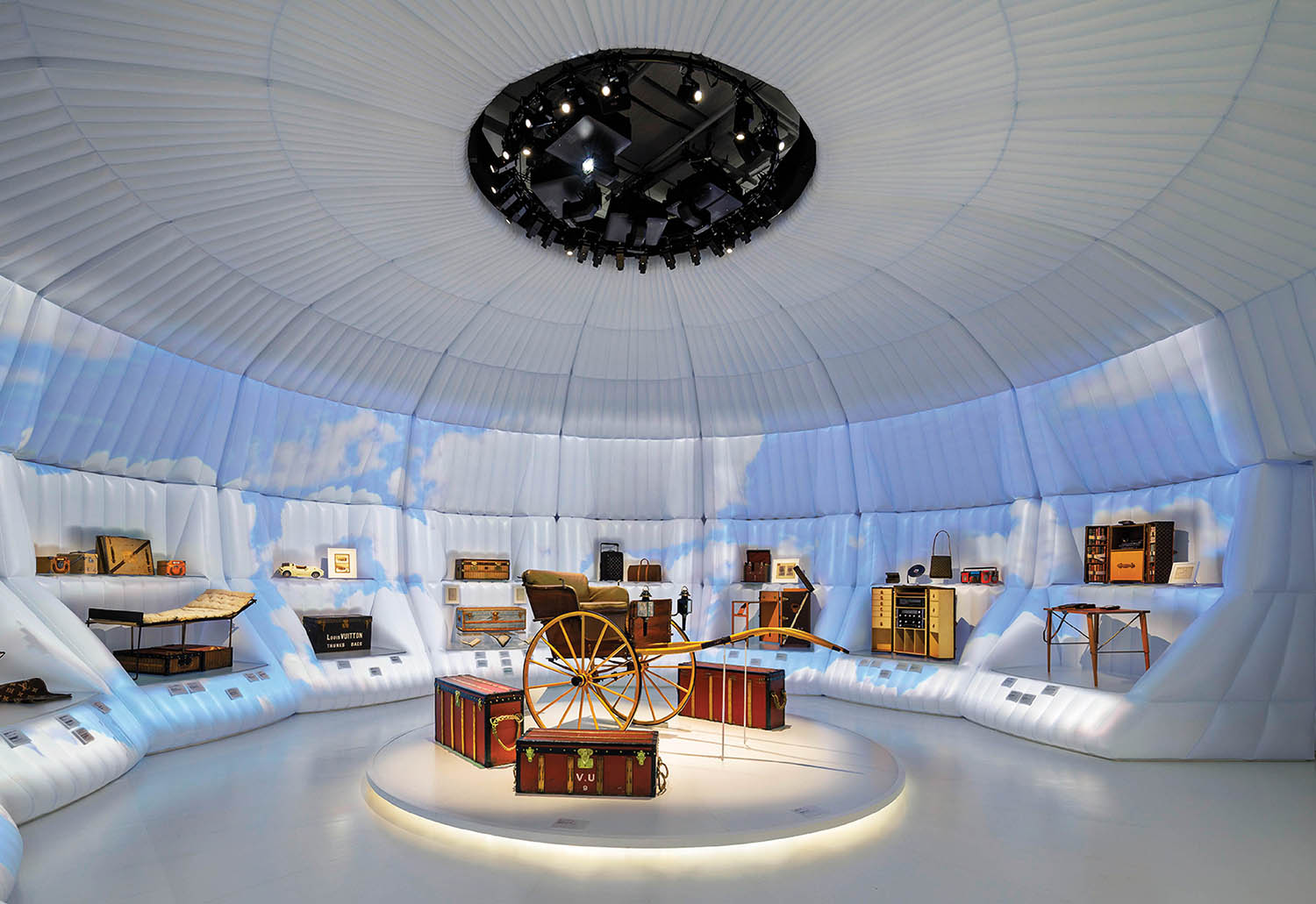 A room with a round ceiling and a clock.