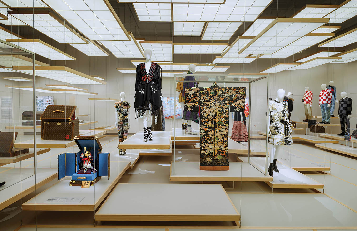 A display of clothing and shoes in a store.