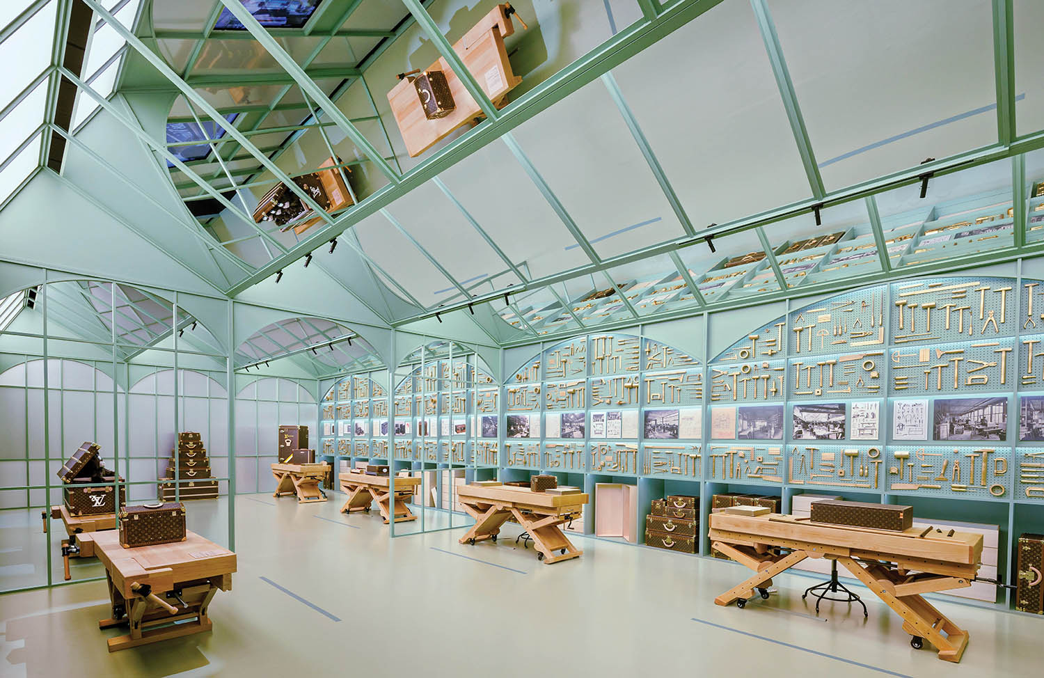 A room with a lot of tables and benches.