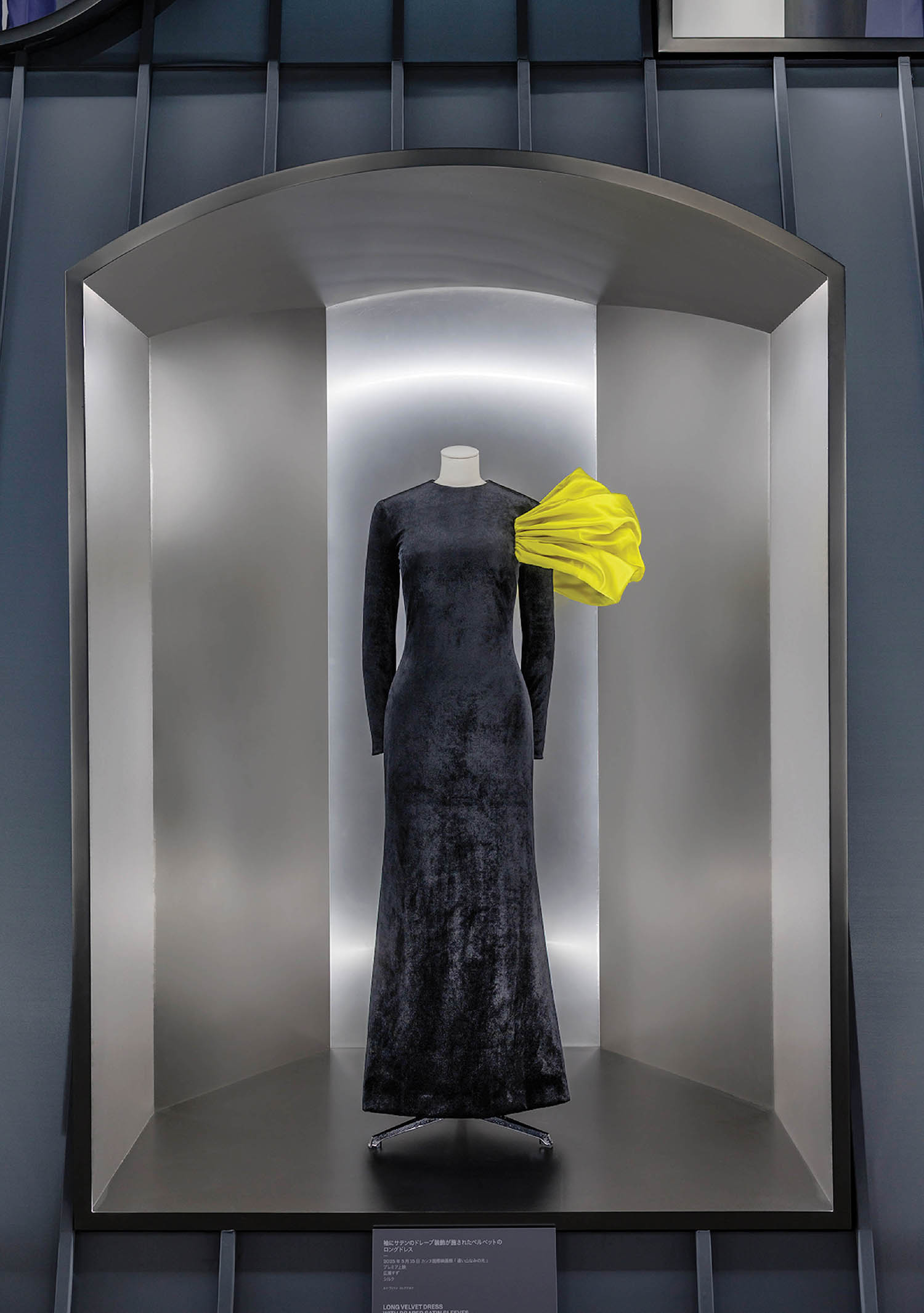 A black dress with a yellow umbrella.