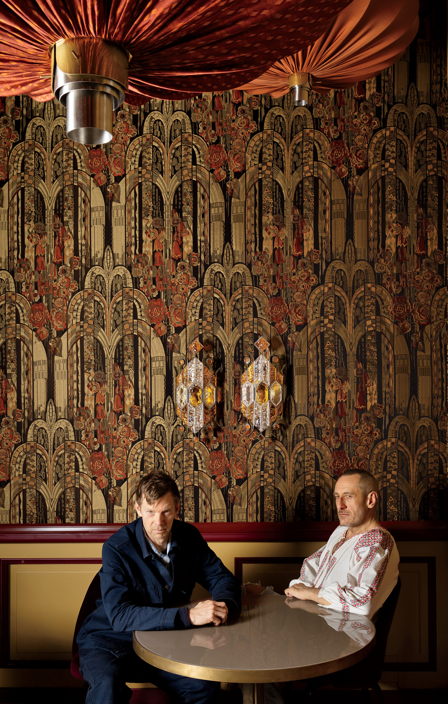 two men sitting at a table