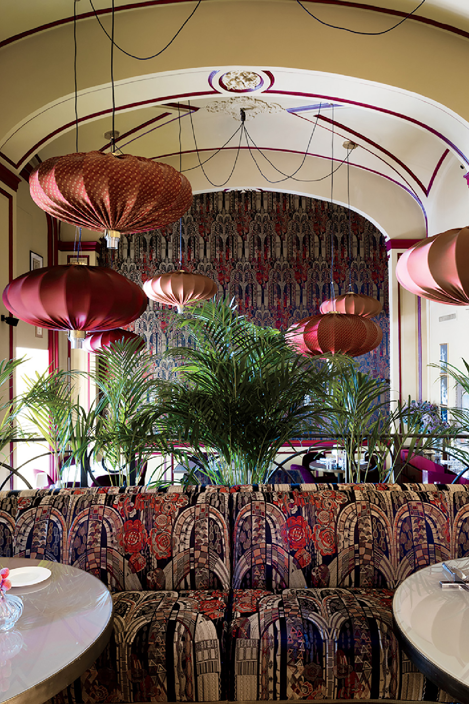 A restaurant with a large table and chairs