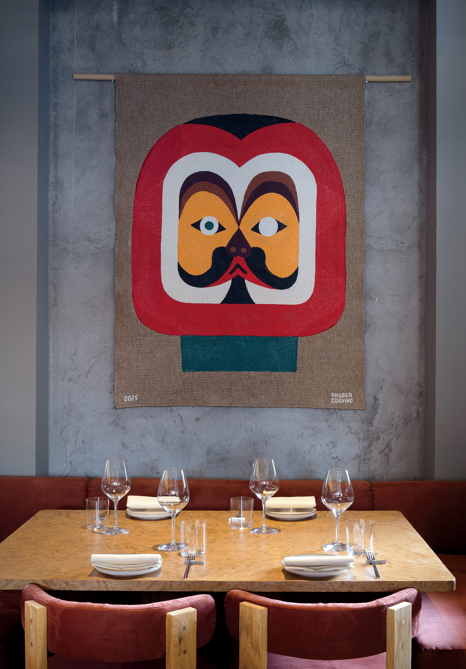 A painting of a man ' s face on a wall