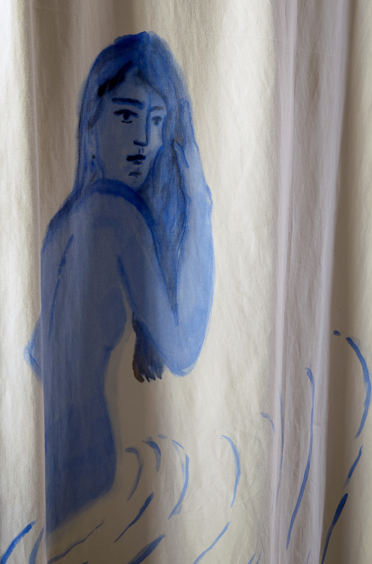 A blue painting of a woman sitting on a bed
