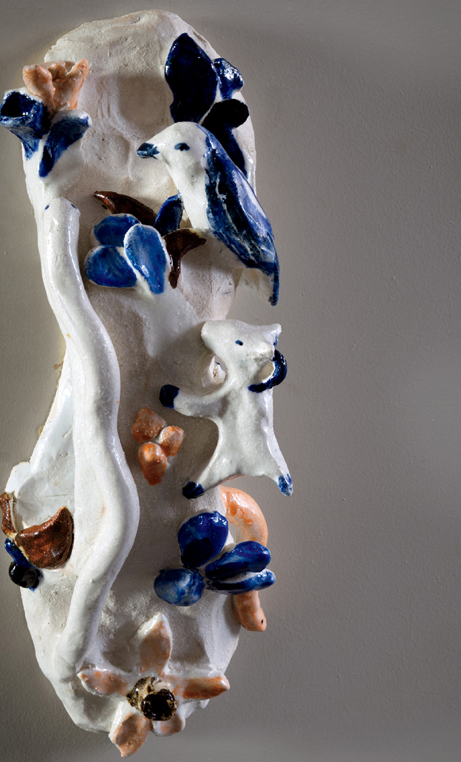 A sculpture of a white and blue bird