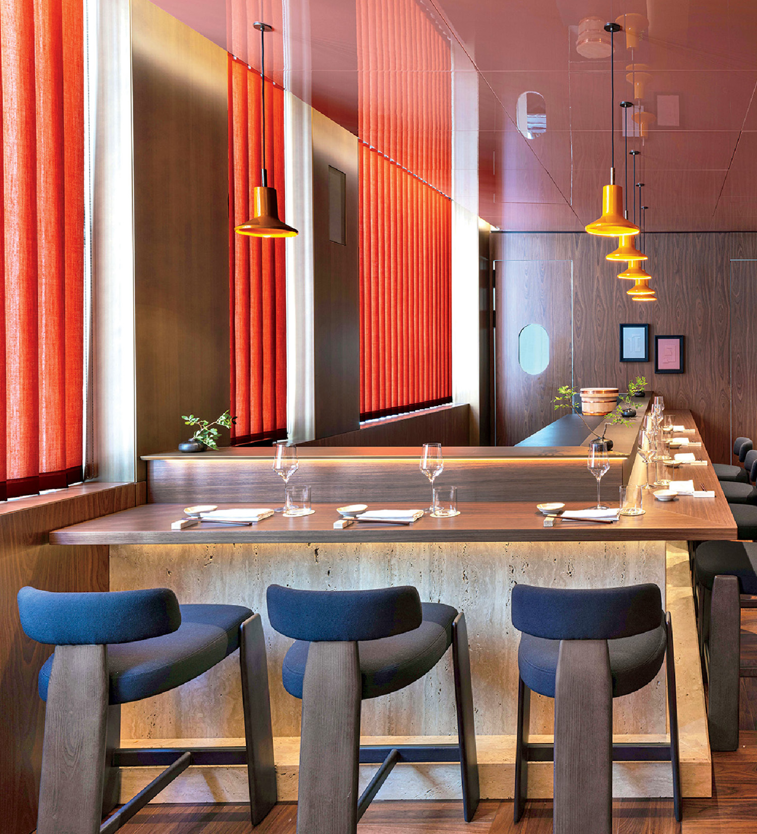 A restaurant with a long table and chairs