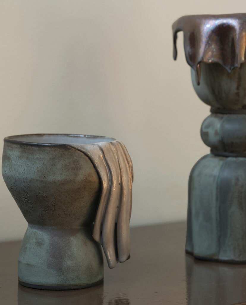 A couple of vases sitting on a table