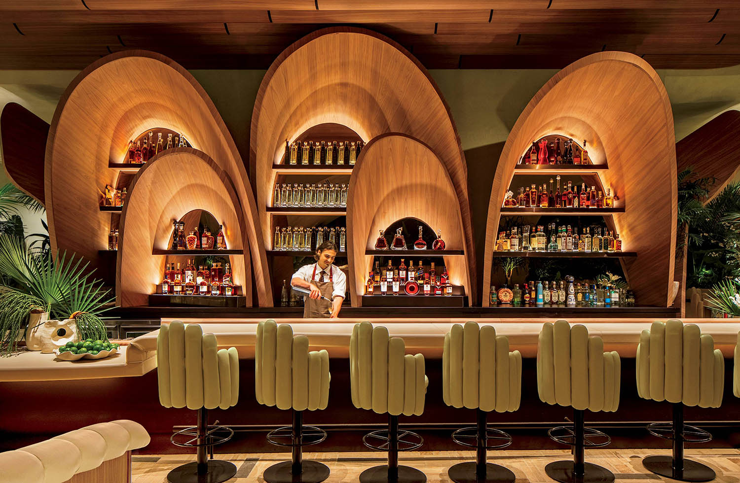 A bar with a lot of bottles of alcohol.