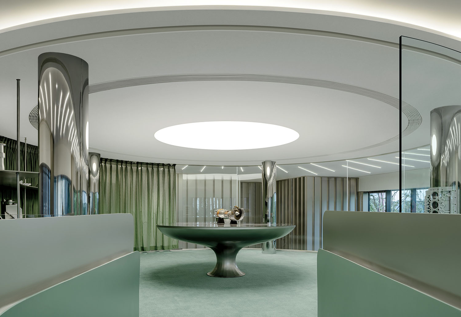 A room with a round table and a mirror.