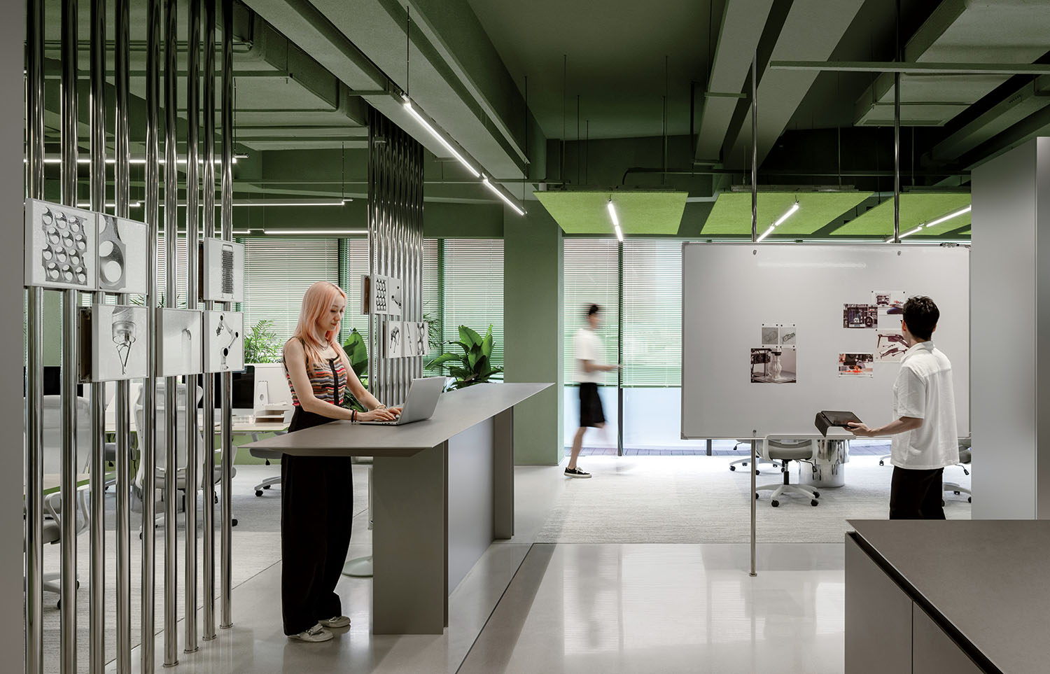 A man and woman are working in an office.